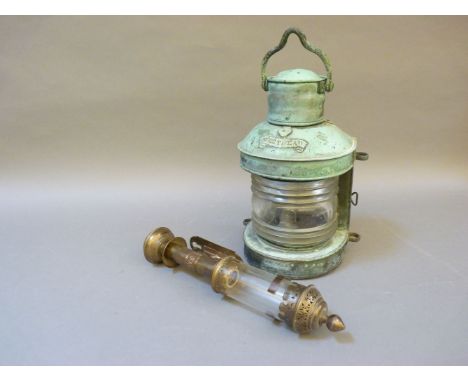 A 19th century copper hand held ship's light, with label 'Mast Head', and trade label for Pascall Atkey & Son, Cowes, fitted 