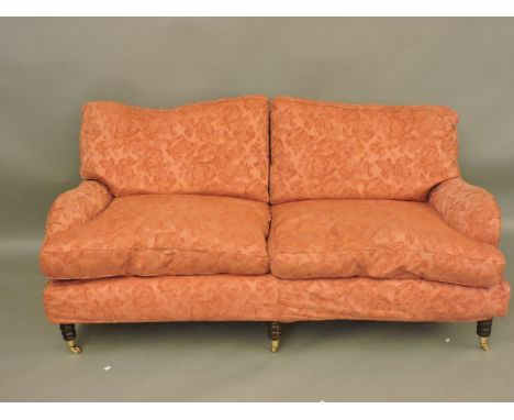 A modern Multiyork three piece suite, in pink rose pattern fabric, the settee with re-attached back legs, 190cm wide