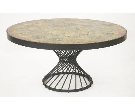 A tile top table, the circular top inset with tiles painted with silhouettes of autumnal leaves, on a wrought iron stand, 106