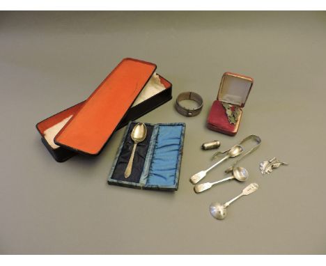 A Victorian silver bangle, a quantity of Georgian and later spoons, and further silverware