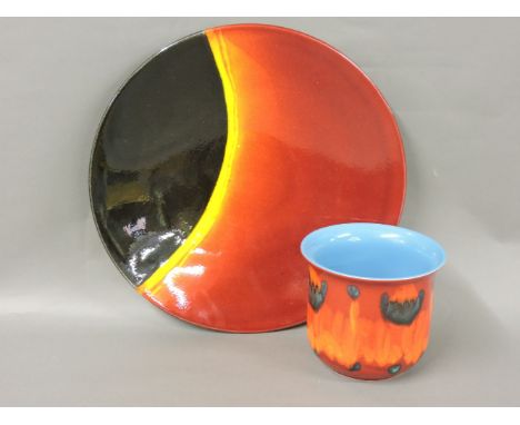 A Poole pottery 'Eclipse' charger, together with a Poole jardinière, the charger 41cm diameter