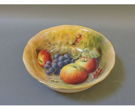A Royal Worcester bowl, painted with apples and grapes, signed Ricketts, two small chips