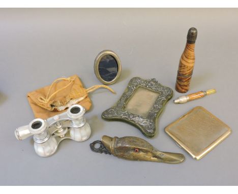 A bronze duck letter clip, a pipe with a naked lady stanhope, mother of pearl opera glasses, silver frames, etc