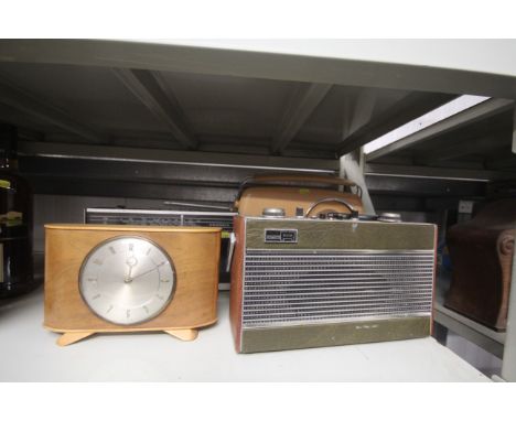 A Bush radio, a Grundig radio, a Roberts radio and a mantle clock 