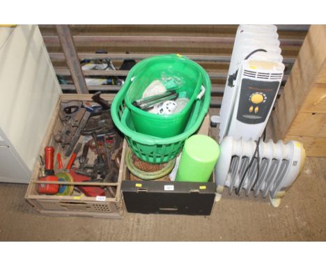A box containing a foam roller, pine cones, brush, a hardwall tacker tile hanging kit, a laundry basket. plastic buckets with