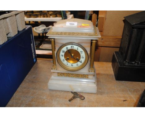 An onyx and gilt eight day mantel clock
