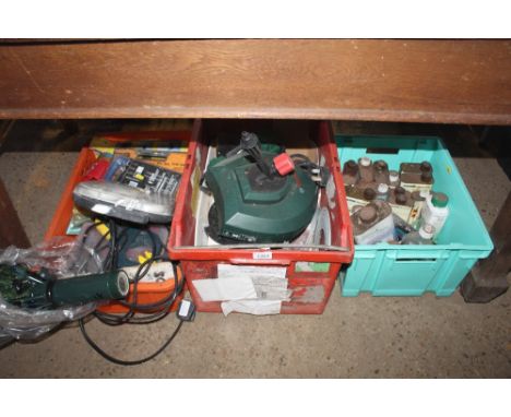 A box containing various wood dyes; pressure washer attachments; various drill bits and hand tools