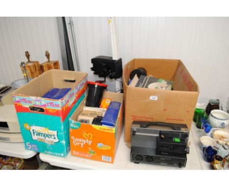 A photographic enlarger and various accessories and a Hanimex projector and accessories