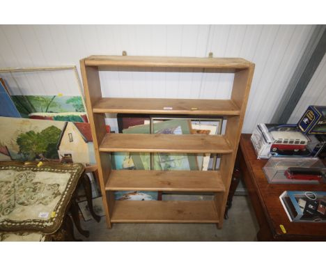 A stripped pine wall shelf