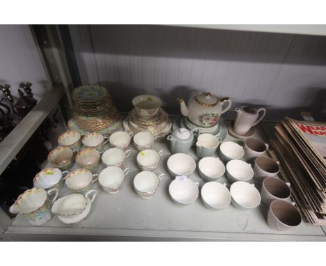 A collection of Poole pottery twin tone tea ware, Tuscan china tea ware