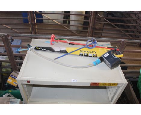 Two paint stirrers, a Stanley 65cm handsaw and a Premium Smart timer for water pipes