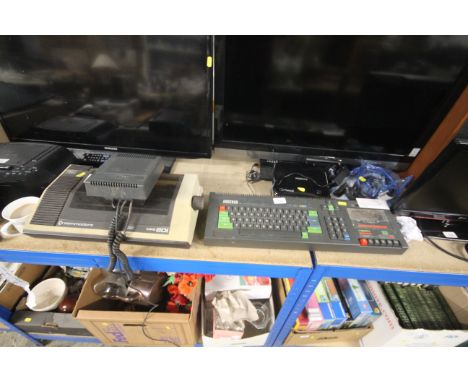 An Amstrad 64K colour personal computer CPC 464 and a Commodore MPS801 printer, both sold as collector's item