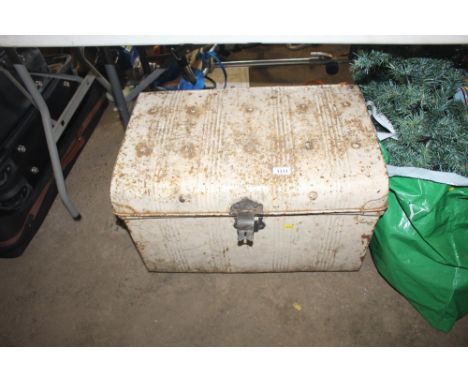 A tin storage trunk