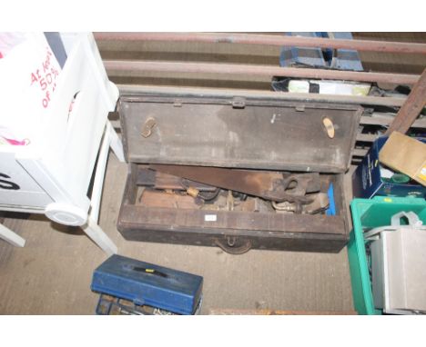 A carpenters tool box and contents of various tools including hand saw, wooden smoothing plane, moulding plane , wooden malle