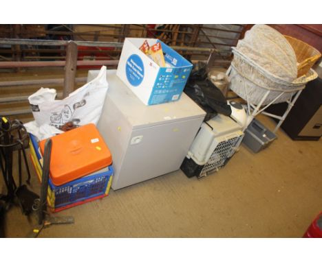 A metal single door cabinet fitted single shelf and a large Atlas 40 pet carrying crate