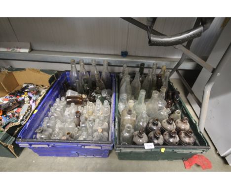Two boxes of vintage glass bottles
