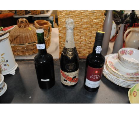A bottle of Ruby Port and a bottle of Cordon Rouge champagne