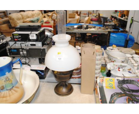 An oil lamp and shade