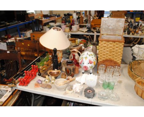 A large piggy bank; an Oriental decorated table lamp; coat hooks; walking sticks; pestle and mortar; running glazed vase; gla
