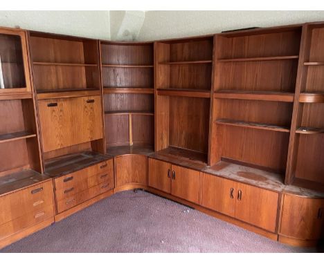 A Mid Century wall unit made by G-Plan comprising of four units, one glazed display unit, one drinks cabinet, two book cases 