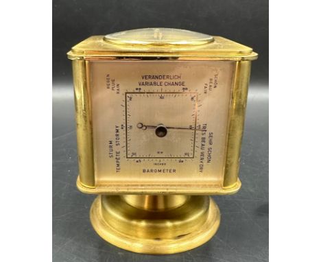 A vintage brass Angelus desk clock/weather station. Having rotating cube shaped body with alarm clock, Hygrometer, Barometer,