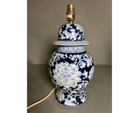 An Oriental style table lamp on wooden base H 46cm