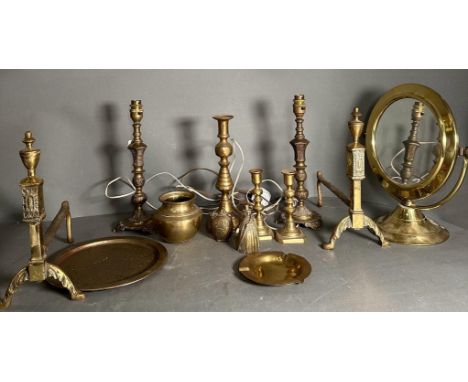 A quantity of brass items to include candlestick, fire dogs and a mirror 