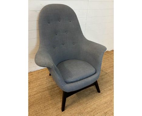 A grey Ikea button back arm chair 