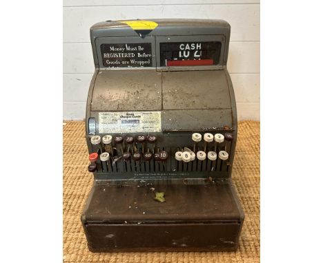 A vintage national cash register with key 