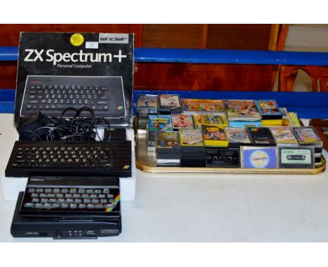A VINTAGE SINCLAIR SPECTRUM ZX+ CONSOLE WITH BOX, TOGETHER WITH ANOTHER ZX CONSOLE, A TAPE CASSETTE DESK &amp; A COLLECTION O