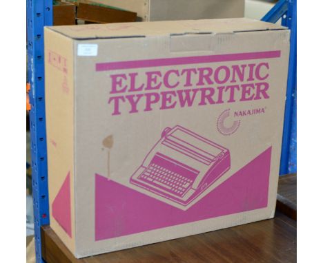 A VINTAGE ELECTRONIC TYPEWRITER IN BOX    
