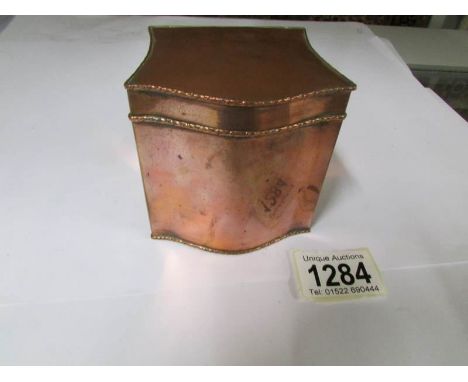 A Georgian copper tea caddy.