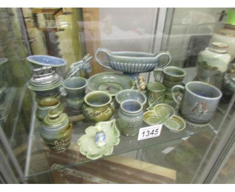 A shelf of assorted Wade items.