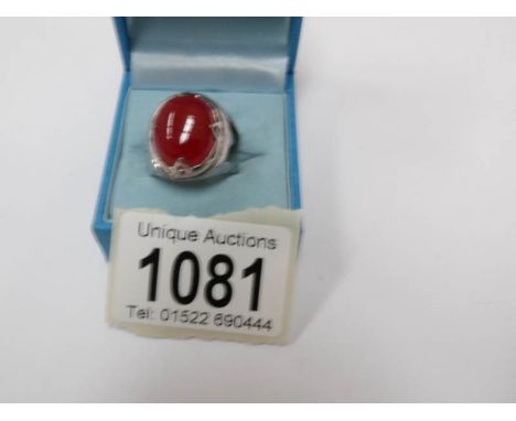 A red jade/silver ring, size P.