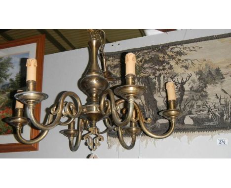 A 6 lamp brass ceiling light.