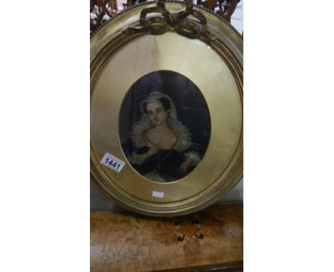 An oval gilt framed and glazed portrait of a lady.