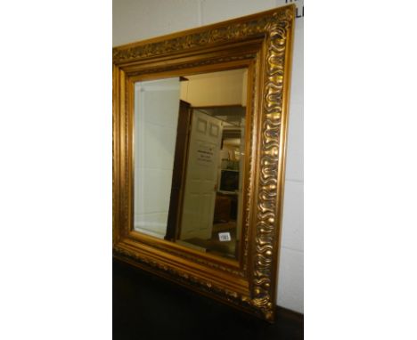 A gilt framed bevel edged mirror