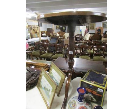 A 19th century oak tripod table.