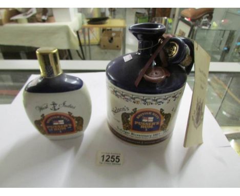 An unopened flagon of Pusser's British Navy 'Nelson's Blood' rum for Trafalgar bicentenary and an Empty Pussar's ceramic hip 