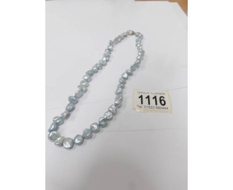 A pale blue Keisha pearl necklace by Honora pearls.