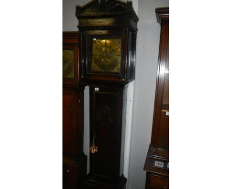 A Georgian 8 day oak long case clock by W Barnard Of Newark, brass face & with a hand carved portrait on the door. Restored &