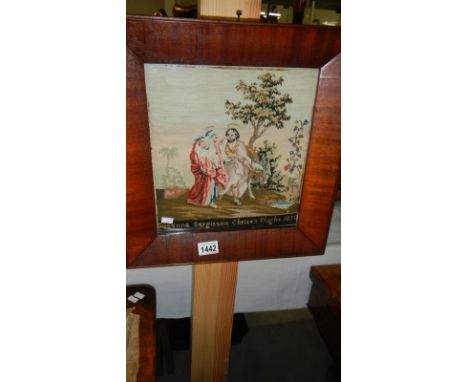 A framed and glazed tapestry.