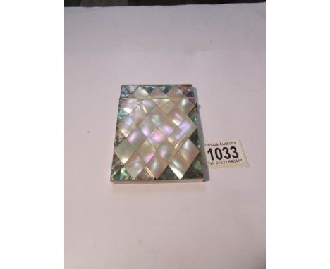 A 19th century mother of pearl card case.