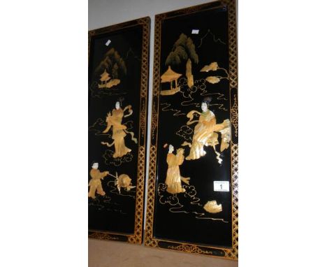 A pair of Japanese lacquered and mother of pearl panels.