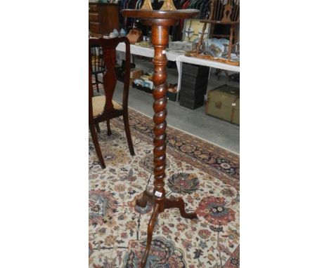 A plant stand on tripod base and with barley twist stem,.
