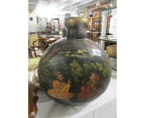 An oriental metal flask.