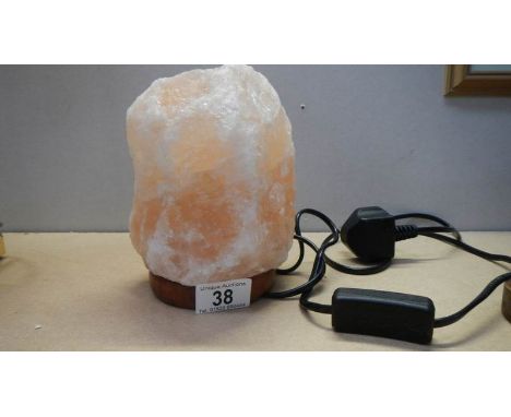 An amber coloured crystal table lamp.