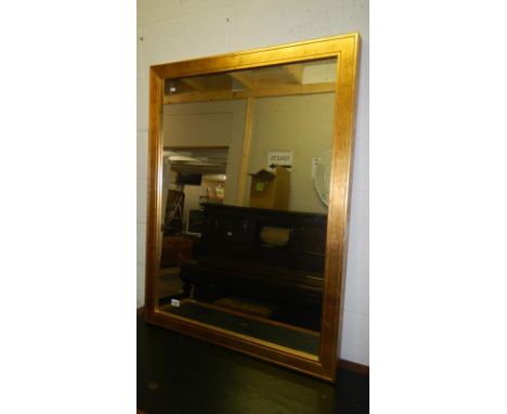 A large gilt framed mirror
