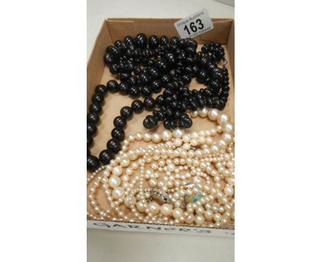 3 black bead necklaces, 2 pearl necklaces and one other a/f necklace.