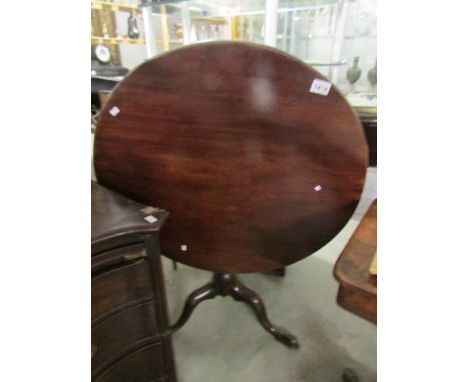 A Victorian mahogany tripod tip top table.